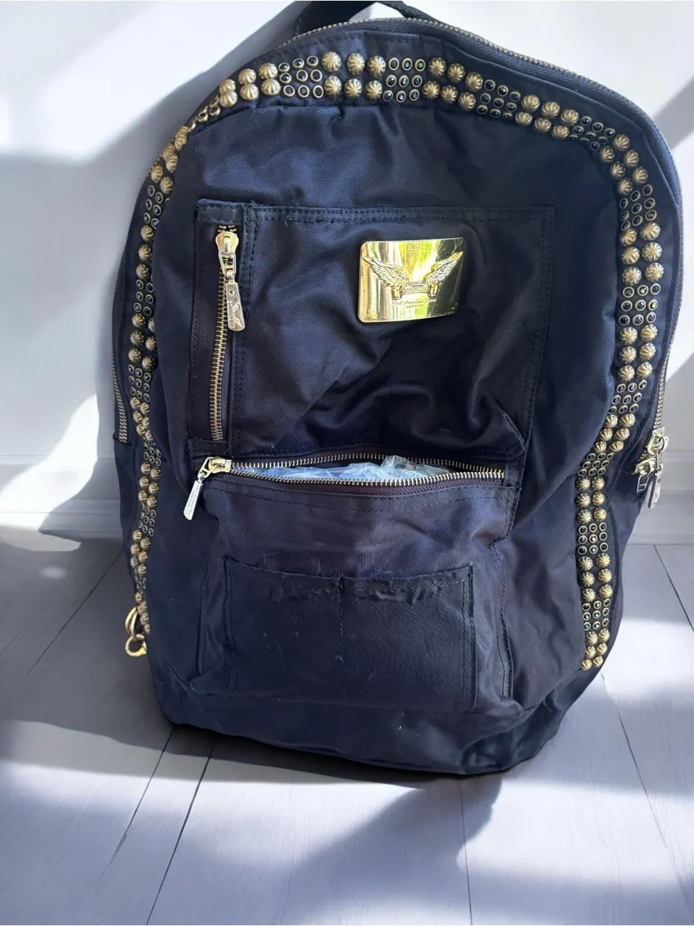 Jean Studded Backpack designed with an edgy  streetwear aesthetic.